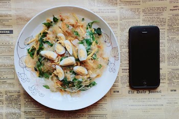Black Iphone 5 Near Plate of Pasta Dish
