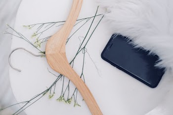 Black Iphone 7 Near Brown Clothes Hanger