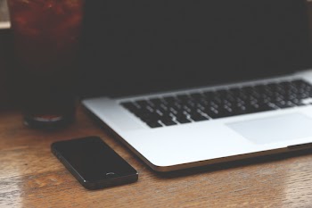 Black Iphone 7 Near Silver Macbook Pro