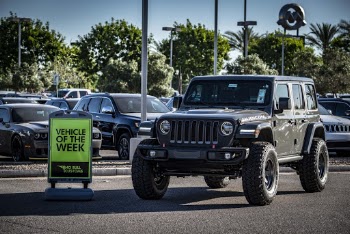 Black Jeep Wrangler Parked Vehicle of the Week Sign