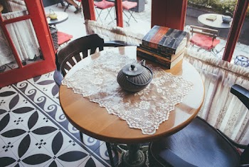 Black Kettle on Brown and Black Wooden Coffee Table