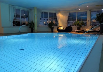 Black Lounger Chair Near Pool