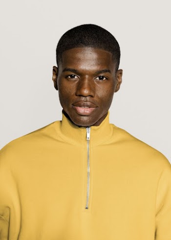 Black man in yellow zip | Free Photo - rawpixel