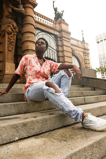 black man sitting on steps