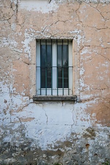 black metal window rail and white wooden framed glass window