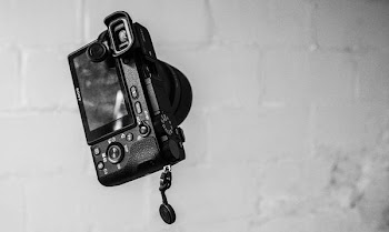 black MILC on grey wall