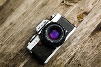 black Minolta DSLR camera on board