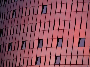 Black Mirror Mounted on Red Wall Building
