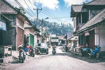 Black Motor Scooter Parked Near Black Vehicle