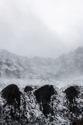 black mountain covered with snow