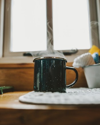 Black Mug on White Textile