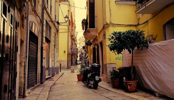 Black Naked Motorcycle Surrounding by Houses