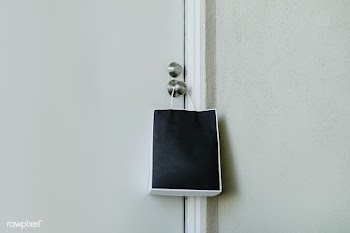 Black paper bag hanging on a door knob during the coronavirus pandemic | Free  photo - 2328069