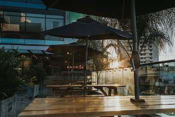Black Patio Umbrella Near Buildings
