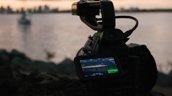 Black Professional Camera on Rock