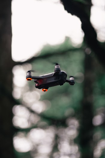 Black Quadcopter Drone Hovering Mid-air