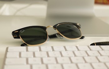 Black Ray-ban Clubmaster Sunglasses on White Surface
