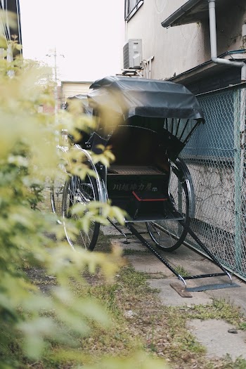 Black Rickshaw on Narrow Pathway