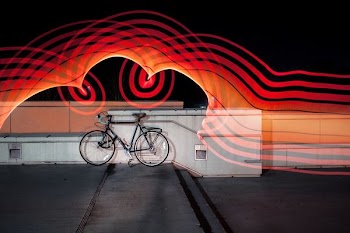 black road bike parked on wall
