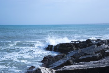 Black Rock Natural Formation Front of Sea