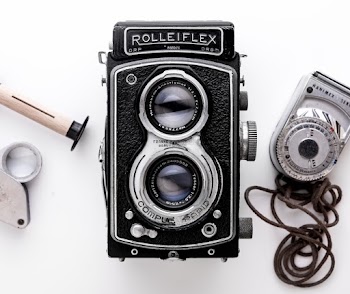 Black Rolleiflex Camera on White Surface