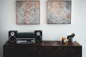 Black Shelf Stereo on Brown Wooden Sideboard