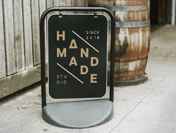 Black Signage Beside Wall