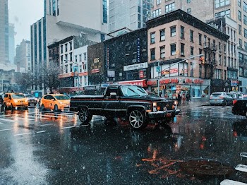 black single-cab pickup truck in street at daytime