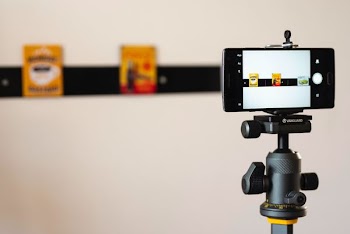 black smartphone on stand