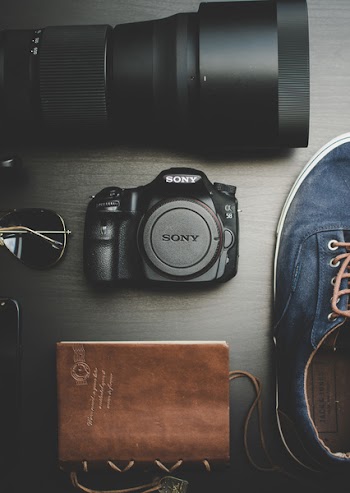 Black Sony Alpha Dslr Camera Body and Lens on Gray Surface
