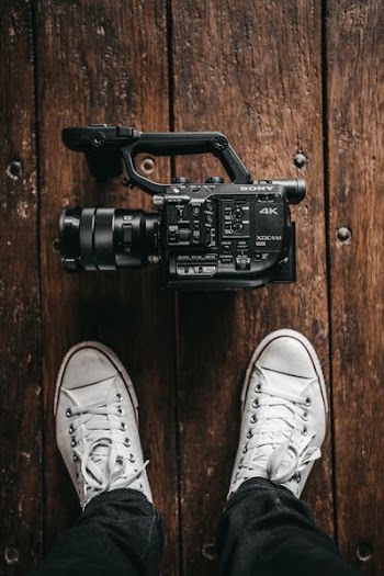 black Sony videocamera on floor