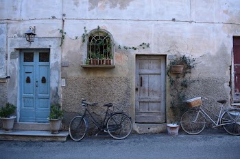 black step-through bike beside on blue door