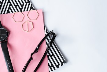 Black Sunglasses on Pink Card
