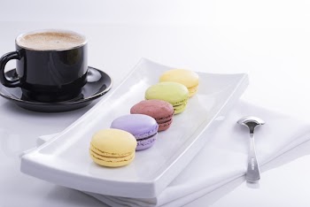 Black Teacup and 5 French Macaroons on Plate