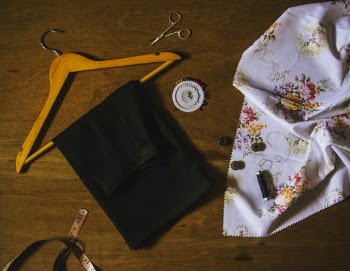 Black Textile on Brown Wooden Clothes Hanger