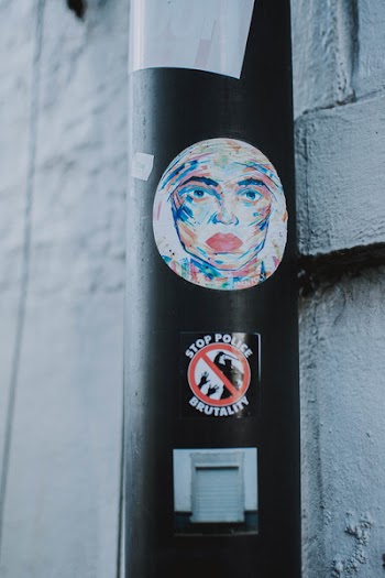 Black Tube With Sticker of Woman