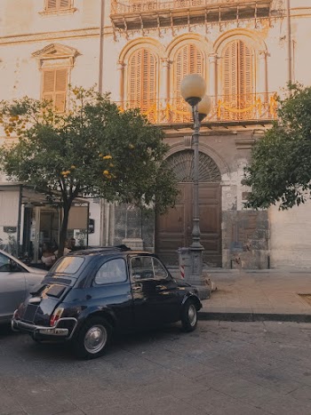 Black Vehicle Parked in Front of Building