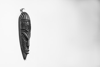 Black Wooden Tiki Mask on Wall