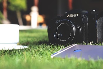 Black Zenit Dslr Camera in Shallow Focus Photography