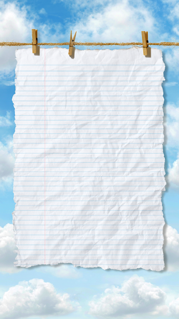 Blank Notebook Paper on Jute Clothesline Against Blue Sky