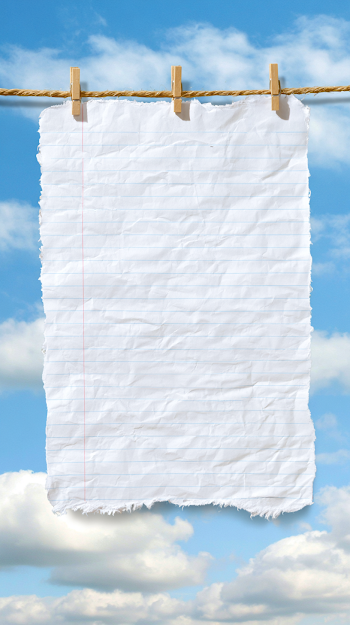 Blank Ruled Notebook Paper on a Jute Clothesline