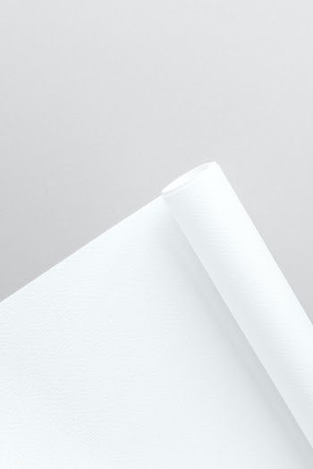 Blank white rolled chart paper on a gray background | Free  photo - 2363556