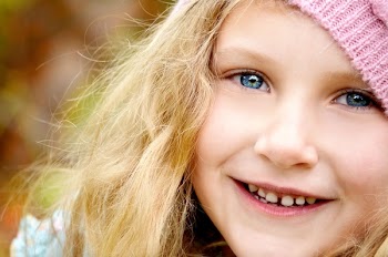 Blond Haired Girl Wearing Pink Knitted Cap
