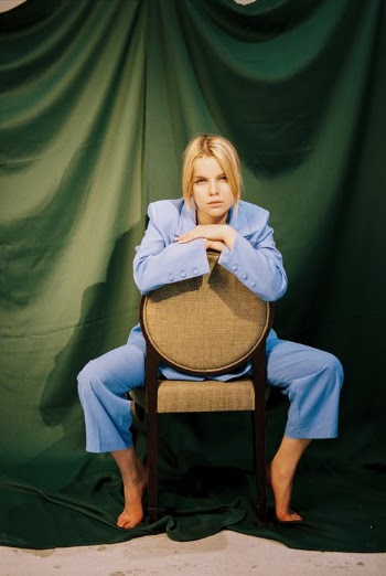 Blond Haired Woman Sitting on Chair · Free Stock Photo