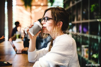 Blond woman having a cup of coffee