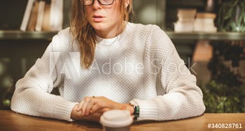 Blond woman having a cup of coffee
