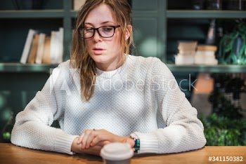 Blond woman having a cup of coffee