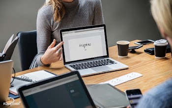 Blond woman pointing at a laptop screen | Free stock psd mockup - 414405