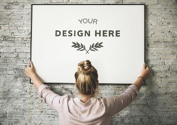 Blonde girl holding a mockup | Free PSD Mockup - rawpixel