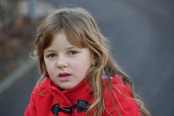 Blonde Girl Wearing Red Toggle Jacket